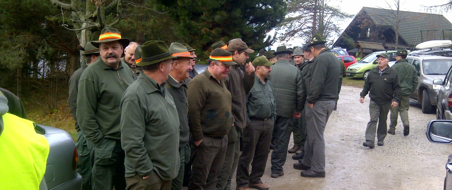 a communal hunt where traditions are practiced, instructions at the start, green clothing & hats